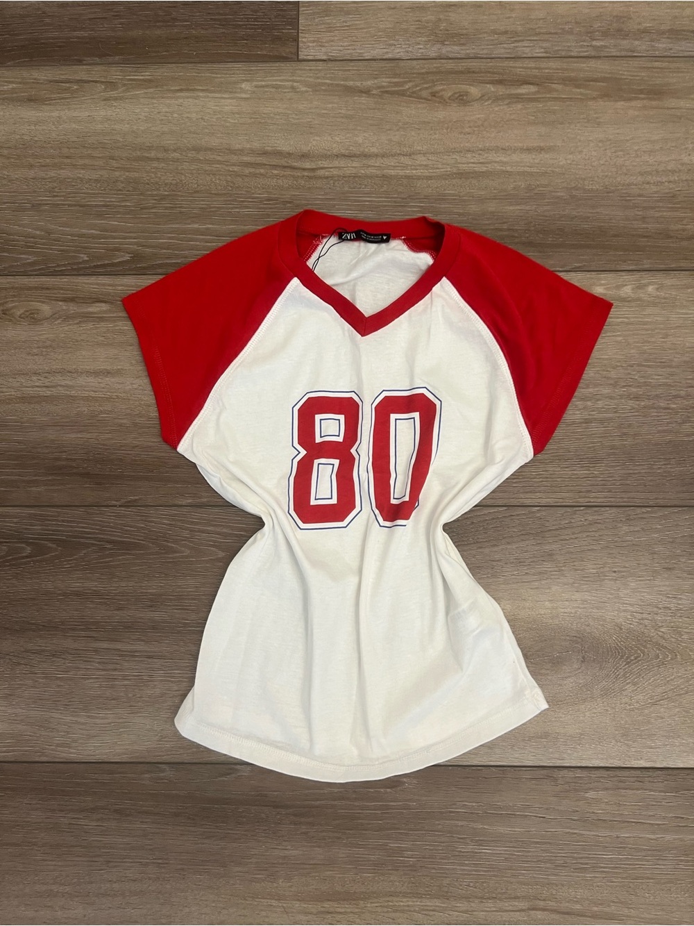 Zara White Tee with Red Raglan Sleeves and 80 Graphic